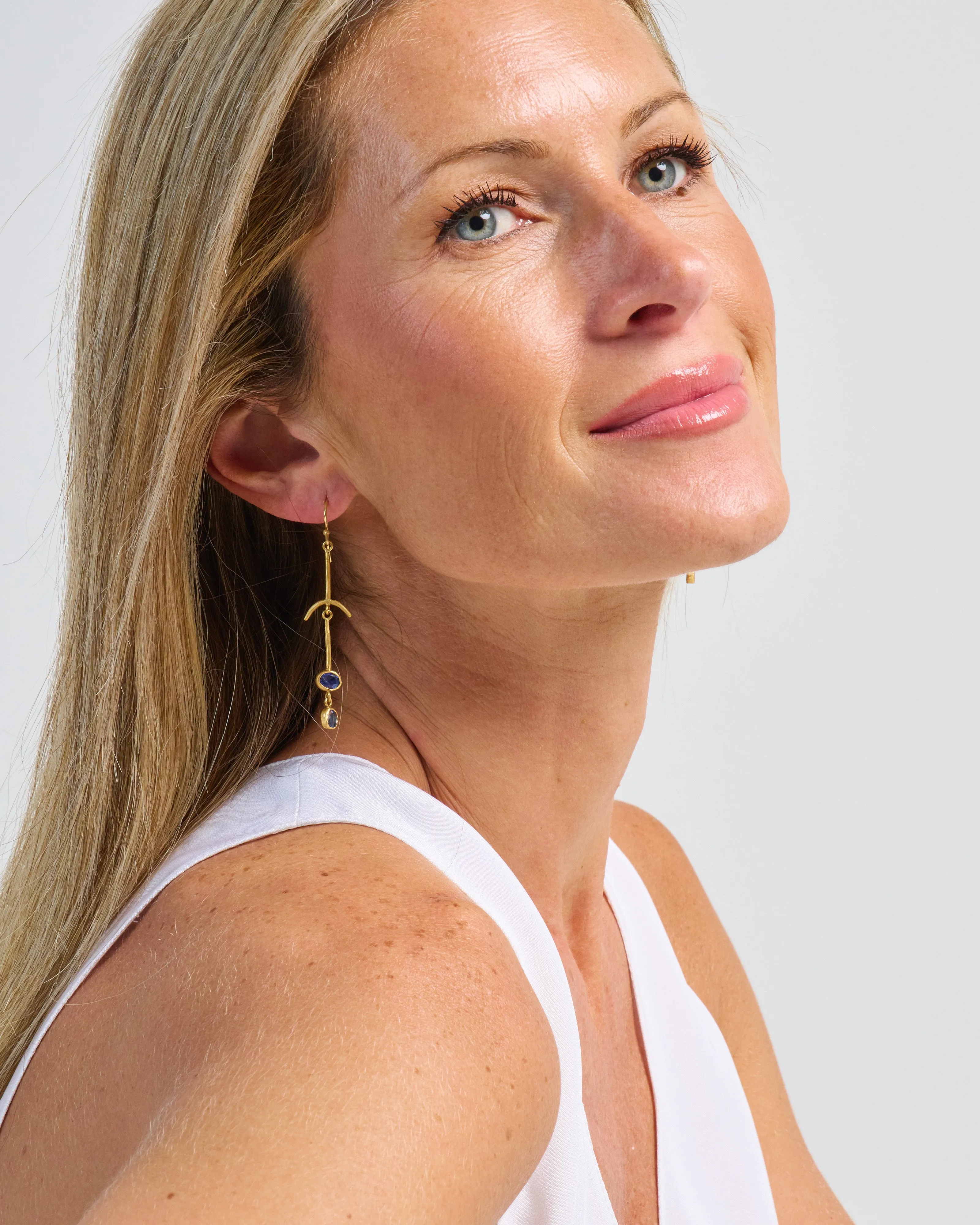 blue sapphire drop bone earrings