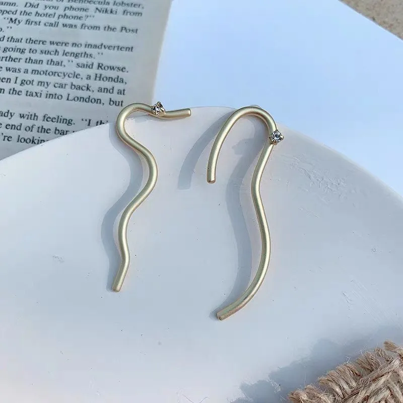 Curvilinear Spark Gold Studs