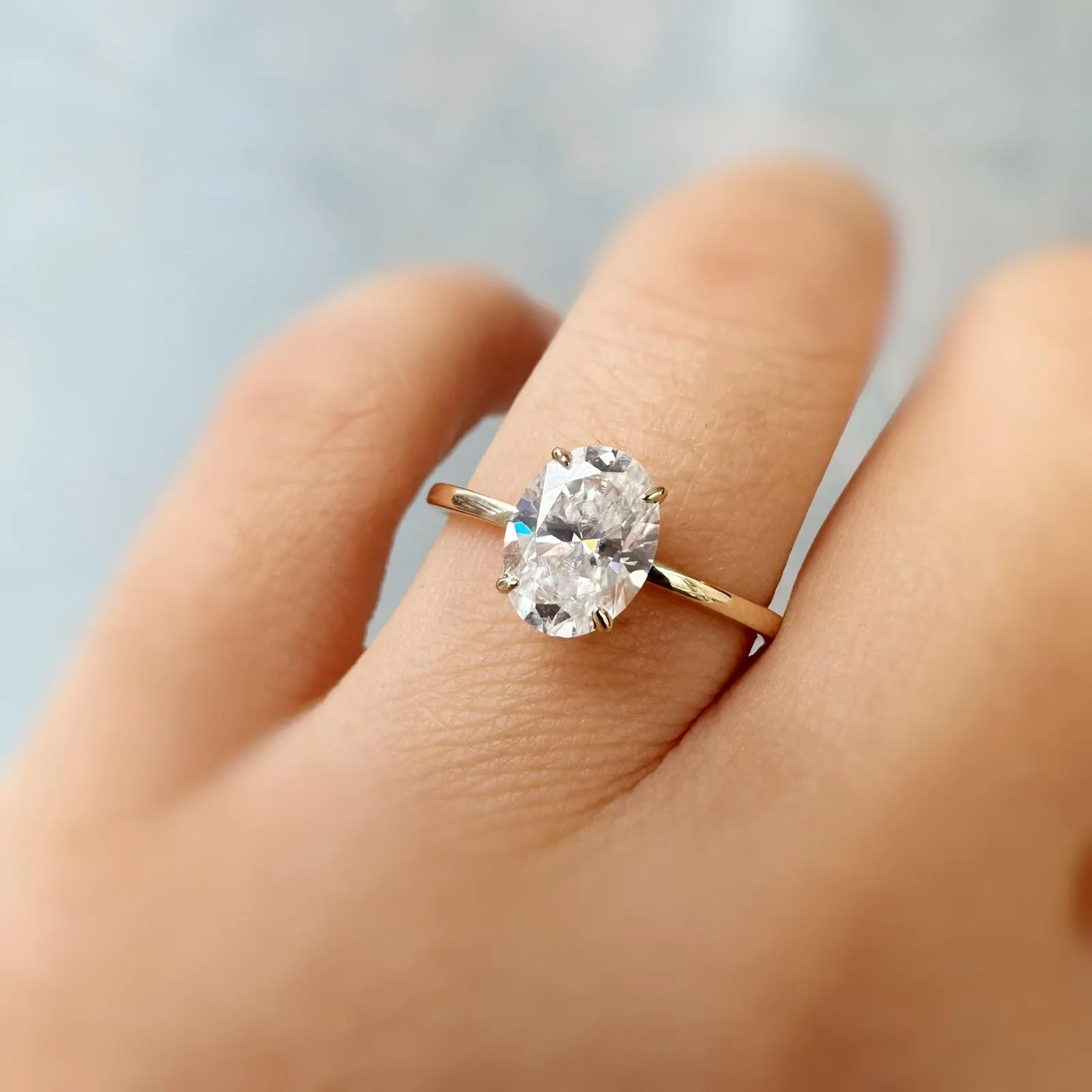 Hidden Ruby Heart Oval Moissanite Yellow Gold Ring