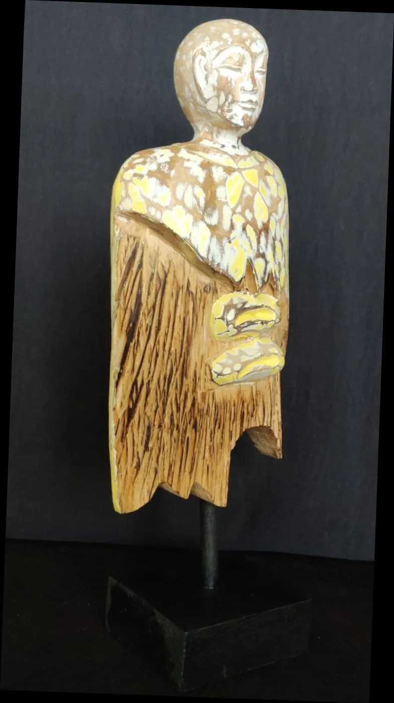 Home Decor.
Contemporary Serene Buddhist Monk Wooden Statue mounted on a rustic wooden base.