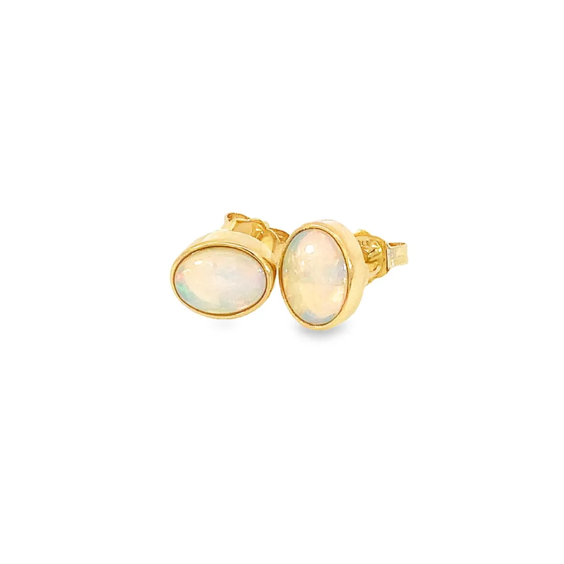 One pair of 9kt Yellow Gold Light Opal earring studs 7x5mm bezel set