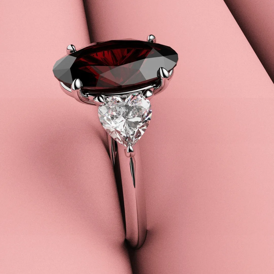 Oval Ruby and Heart Diamond Trilogy Engagement Ring