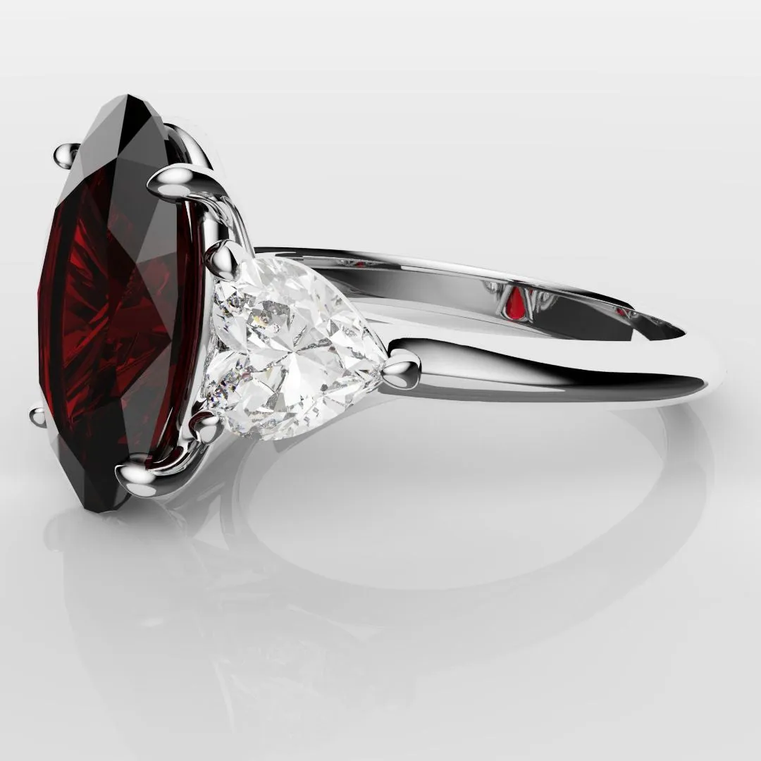 Oval Ruby and Heart Diamond Trilogy Engagement Ring