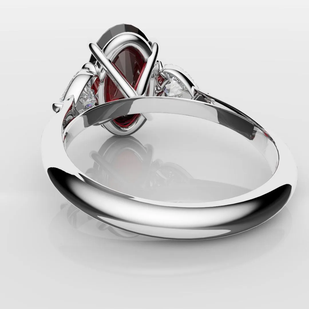 Oval Ruby and Heart Diamond Trilogy Engagement Ring
