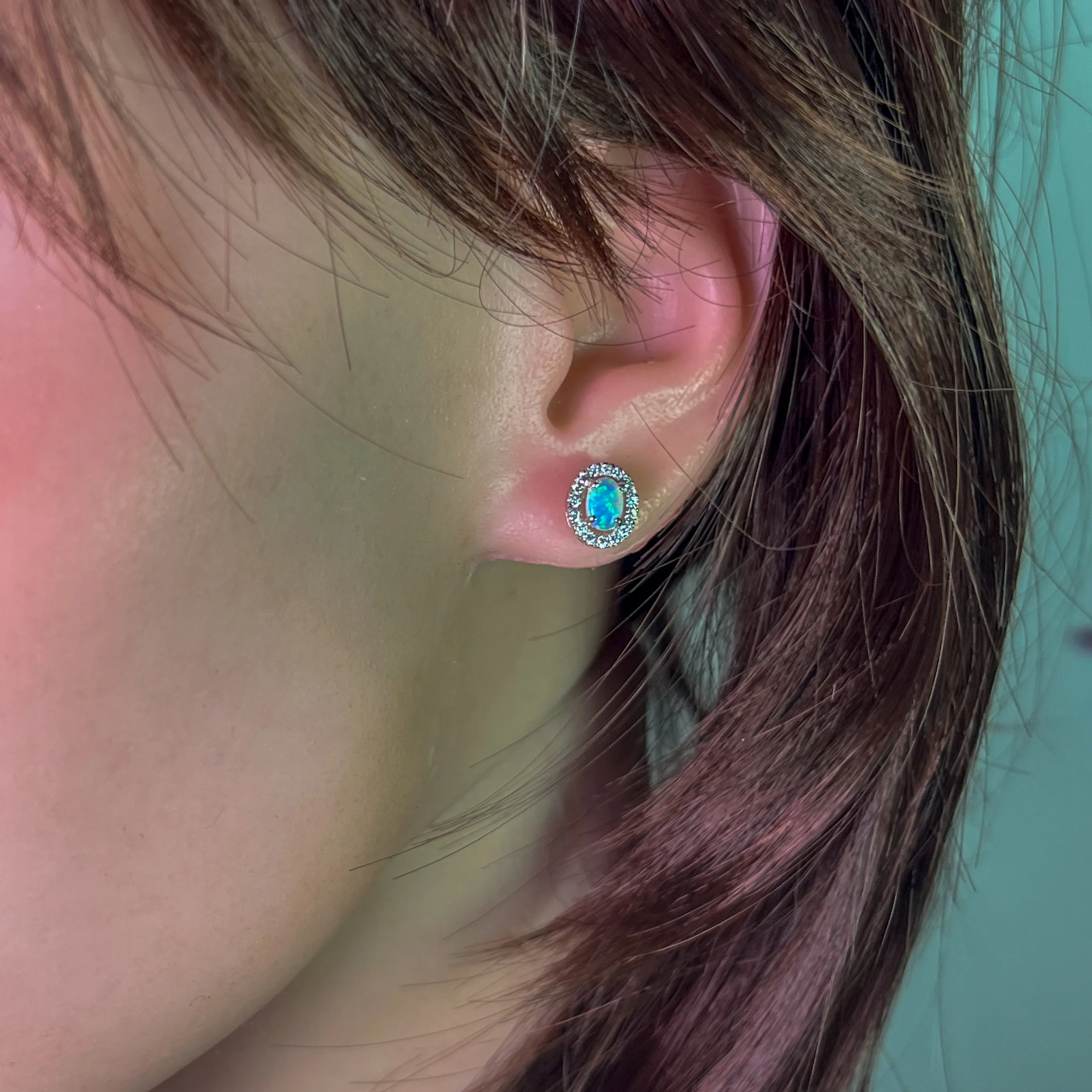Pair of 18kt White Gold halo Opal and diamond studs